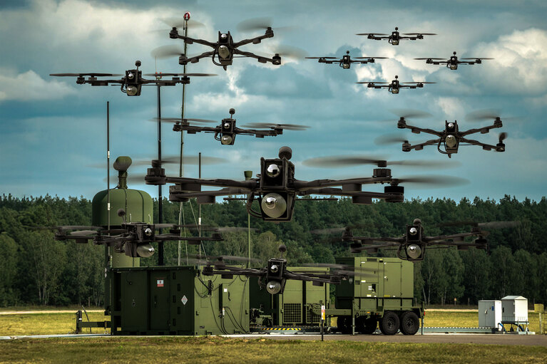 Image of autonomous vehicles hovering above a ground station